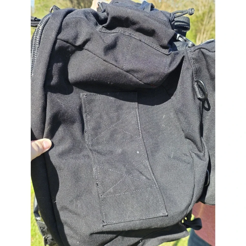 black tactical backpack is a Sandpiper of California Bugout Bag **see Pics**